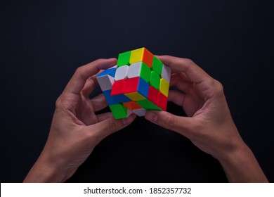 Girona, Spain; 11 10 2020: Woman Solving A Puzzle Cube