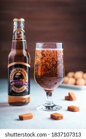 GIRONA, SPAIN - FEBRUARY 19, 2020: Flying Cauldron Butterscotch Beer, Famous Delicious Drink From Harry Potter World On Wooden Background