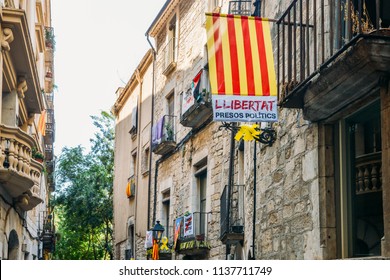 Girona, Spain - July 10, 2018: Catalonia Independence Flags On Balconies. The Catalan Independence Movement Is A Political Movement Historically Derived From Catalan Nationalism