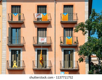 Girona, Spain - July 10, 2018: Catalonia Independence Flags On Balconies. The Catalan Independence Movement Is A Political Movement Historically Derived From Catalan Nationalism