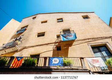 Girona, Spain - July 10, 2018: Catalonia Independence Flags On Balconies. The Catalan Independence Movement Is A Political Movement Historically Derived From Catalan Nationalism