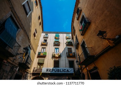 Girona, Spain - July 10, 2018: Catalonia Independence Flags On Balconies. The Catalan Independence Movement Is A Political Movement Historically Derived From Catalan Nationalism