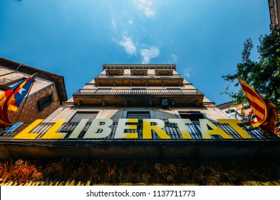 Girona, Spain - July 10, 2018: Catalonia Independence Flags On Balconies. The Catalan Independence Movement Is A Political Movement Historically Derived From Catalan Nationalism