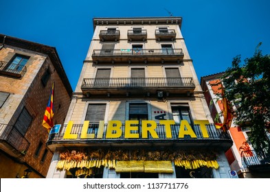 Girona, Spain - July 10, 2018: Catalonia Independence Flags On Balconies. The Catalan Independence Movement Is A Political Movement Historically Derived From Catalan Nationalism