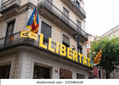 Girona, Spain - October 22, 2019: Catalonia Independence Flags On Balconies. The Catalan Independence Movement Is A Political Movement Historically Derived From Catalan Nationalism