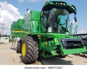 Girov, Romania - JUNE 11, 2021: New John Deere Combine Harvester In A Farm In Romania.