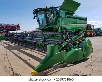 Girov, Romania - JUNE 13, 2021: New John Deere Combine Harvester In A Farm In Romania.