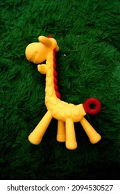 Girrafe Toys At Green Rug