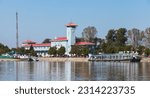 Giurgiu port view on a sunny day with administrative buildings at the coast of Danube River. Romania