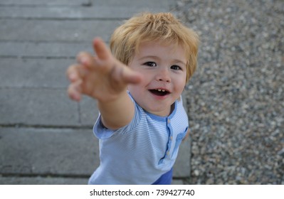 Give Me Gesture, Child Asks To Give Him Something, Reaches Out To Camera. Cute Boy And His Need. Smart Child Takes What The Parent Offers Him. Happy Kid, Satisfaction Of Children's Needs