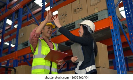 Give Me High Five. Warehouse Worker Having Fun In The Warehouse.