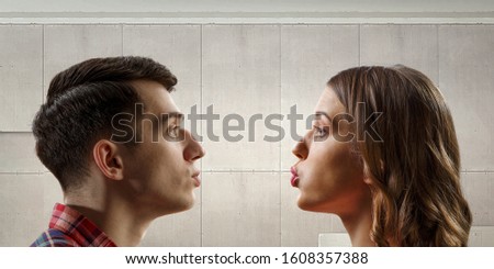 Similar – Man and woman face each other