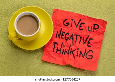 give up negative thoughts - reminder note with a cup of coffee