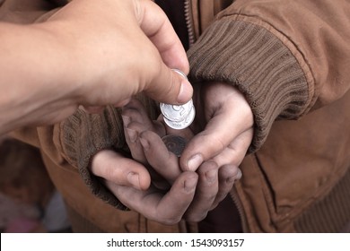 give out coins to the poor,do good deeds,donation . - Shutterstock ID 1543093157