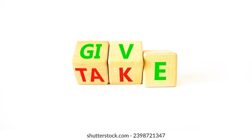 Give or take symbol. Concept word Give or Take on wooden cubes. Beautiful white table white background. Business give or take concept. Copy space.