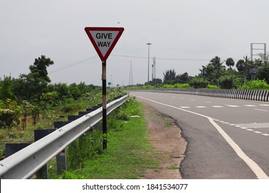 Give way sign on the side of national highway double road, India - Shutterstock ID 1841534077