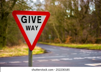 Give Way Uk Road Sign With Blurred Background