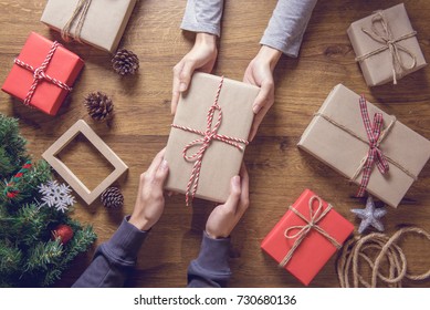 Gives a gift Christmas presents laid on a wooden table decoration background. Xmas concept. - Shutterstock ID 730680136