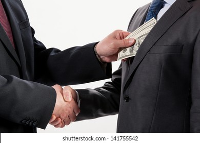 Giving A Bribe Into A Pocket - Closeup Shot