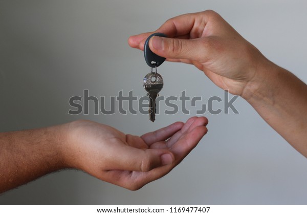 giving the\
car keys with the hand empty\
hand.sales