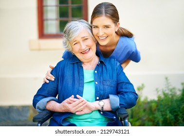 Giving Care To The Best Of Her Abilities. Shot Of A Resident And A Nurse Outside In The Retirement Home Garden.