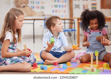 Giving children the freedom to play helps them learn. Shot of a group of preschool students playing together. - Powered by Shutterstock