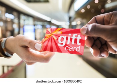 Giving Gift Card Or Voucher In Shopping Mall