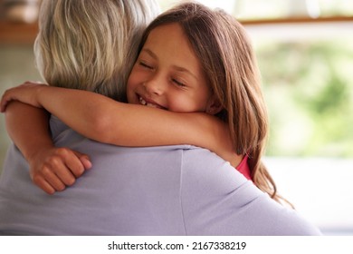 Giving Granny A Big Hug. Shot Of A Cute Little Girl Hugging Her Grandmother.