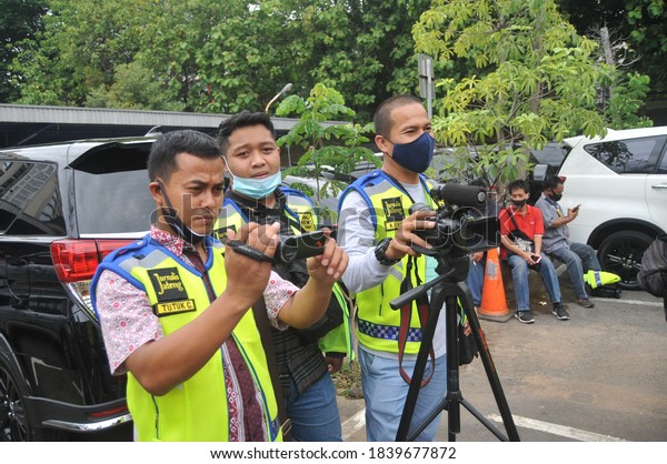 Giving a media vest for coverage of anarchism at the\
Borobudur Police Headquarters in Central Java, (Monday, 19 October\
2020). 