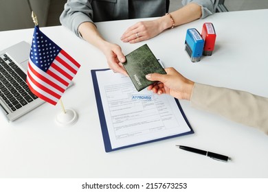 Giving Passport To Embassy Worker - Shutterstock ID 2157673253