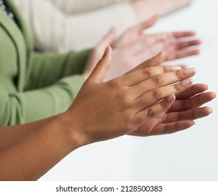 Giving Praise Where It Is Due. Shot Of A Group Of Unidentifiable People Applauding Against A White Background.