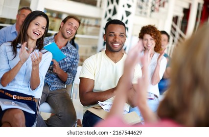 Giving Themselves A Round Of Applause. Shot Of Coworkers Applauding A Presentation In A Casual Office Environment.