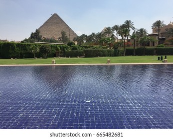 GIZA, EGYPT - MAY 2017:  A view from the Mena House Hotel of the great pyramids of Egypt. The Mena House Hotel located outside Cairo, Egypt, Owned by the Egyptian General Company For Tourism & Hotels