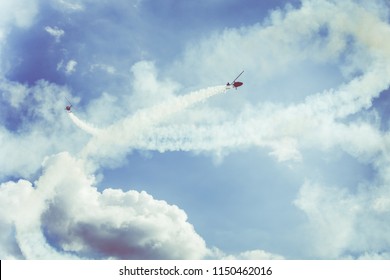 GIZYCKO, POLAND - AUGUST 5, 2018: Gyrocopter or autogyro in flight in the blue sky at Air Show Mazury 2018 event at the lake Niegocin in Gizycko. Poland.