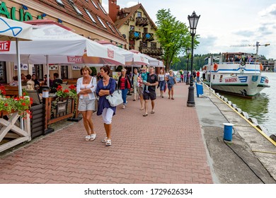 Gizycko, Poland - July 13, 2012: People Walking In Port Of Gizycko, Masuria, Poland.