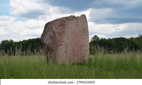 Glacial Erratic Boulder Lying In The Meadow