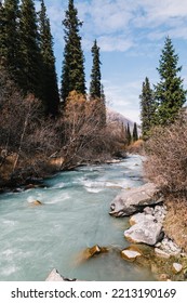 Glacial River Flows Through The Ala Archa Mountain Pass In Kyrgyzstan