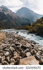 Glacial River Flows Through The Ala Archa Mountain Pass In Kyrgyzstan