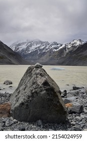 Glacial Rock With View Of Mt Cook At The Edge Of Hooker Lake.