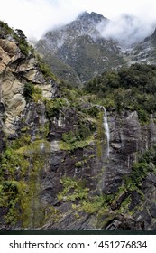 The Glacial Waters Of A Temporary Waterfall Hardly Touch The Sea Water Below As It Is Blown Away By Strong Winds.    