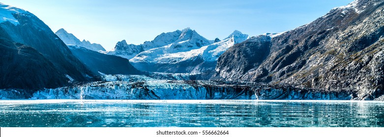 Glacier Bay, Alaska banner landscape from cruise ship cruising towards Johns Hopkins Glacier in summer in Alaska, USA. Banner panorama view.