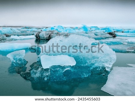 Glacier blue lagoon Jokulsarlon in Iceland, Piece of ice in Iceland, iceberg, black beach sand - Dyamond beach.