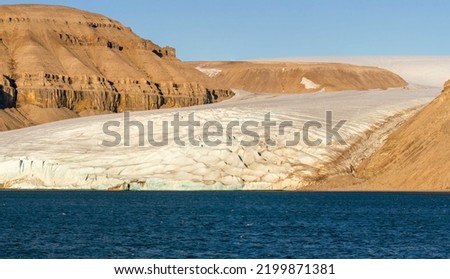 Glacier and fjord on southern coast of Devon Island, Nunavut, Canada.