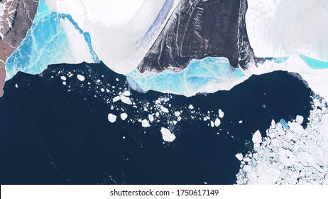 Glacier in Greenland, blocks of ice floating in the ocean, seasonal changes in glaciers. contains modified Copernicus Sentinel data