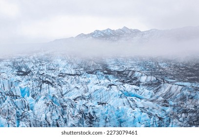 Glacier ice, Glacier Bay National Park and Preserve in the U.S. state of Alaska. Misty moody cloudy day. - Powered by Shutterstock