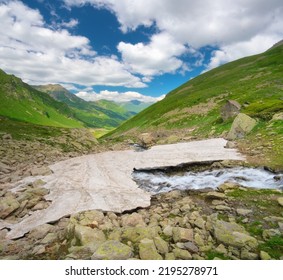 Glacier In Mountain Valey Anв River Stream. Daylight Nature Landscape.