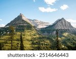 Glacier National Park Montana, Landscape view of Mount Oberlin, Clements Mountain Peak, Mt Cannon, Bird Woman Falls Waterfall, from Going to the Sun Road, Scenic Landscape Photography, Clear Blue Sky