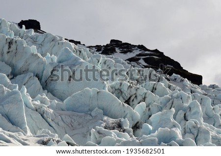Similar – Image, Stock Photo Snow-covered mountain and Icelandic moss