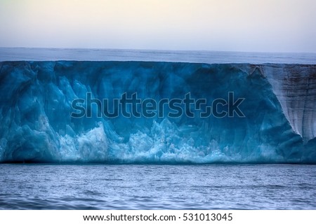 Glaciers of polar caps of the Earth. Ice Wall of sheet glacier (Ice front, zone of ablation), glaciology, glaciers study, climate change, ice melting. Franz Joseph Land, Rudolf island