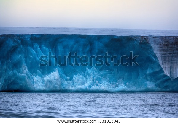 Glaciers of\
polar caps of the Earth. Ice Wall of sheet glacier (Ice front, zone\
of ablation), glaciology, glaciers study, climate change, ice\
melting. Franz Joseph Land, Rudolf\
island